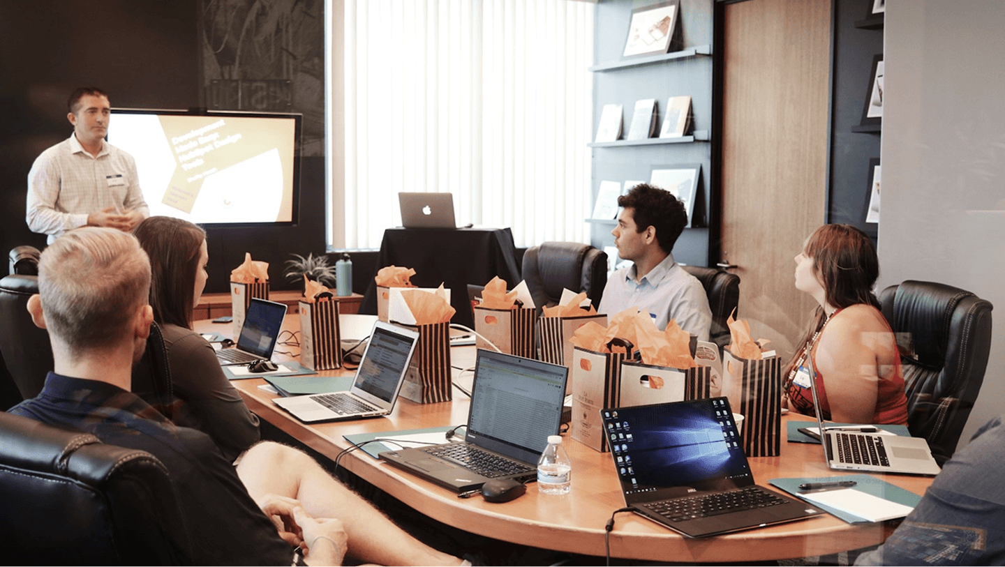 Team reviewing brand & compliance assets in conference room