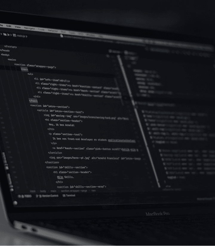 Development laptop displaying source code